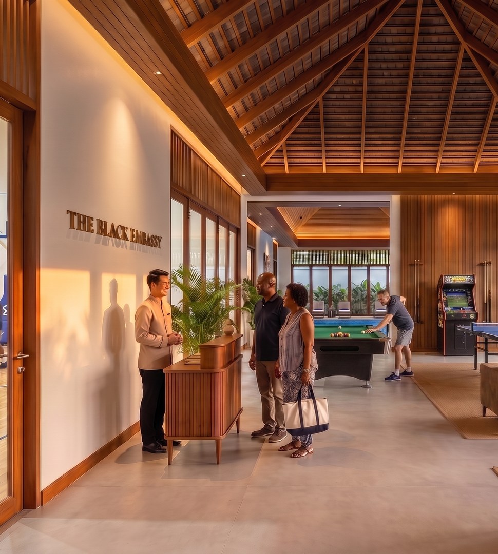 Concept rendering of walking in: the entrance opens directly into a timber-roofed lounge, with a host greeting two visitors.